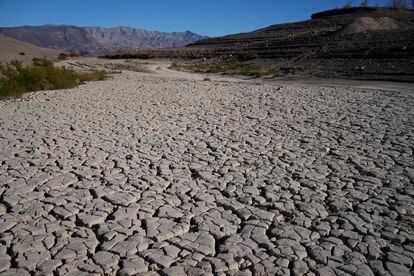 Cracked earth is visible in an area once under the water of Lake Mead at the Lake Mead National Recreation Area, on January 27, 2023, near Boulder City, Nevada.