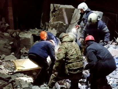 Emergency responders retrieve bodies from the rubble of a devastated building following a Ukrainian attack in a location given as Lysychansk, in the occupied eastern Ukrainian region of Luhansk.