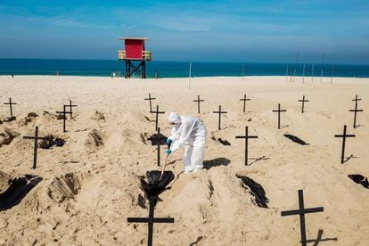 Protesters dig symbolic graves on Copacabana Beach in Rio de Janeiro to protest the government’s handling of the coronavirus crisis.