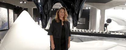 Zaha Hadid poses in the Ivory Press gallery, where her exhibition of paintings, sculptures and designs is currently on show. 
