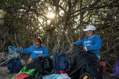 Italia Lira, 63 and Antonia Pech, 77, sew the nets that 'Las chelemeras' use in the process to regenerate the mangroves, off the coast of Progreso, Yucatán.