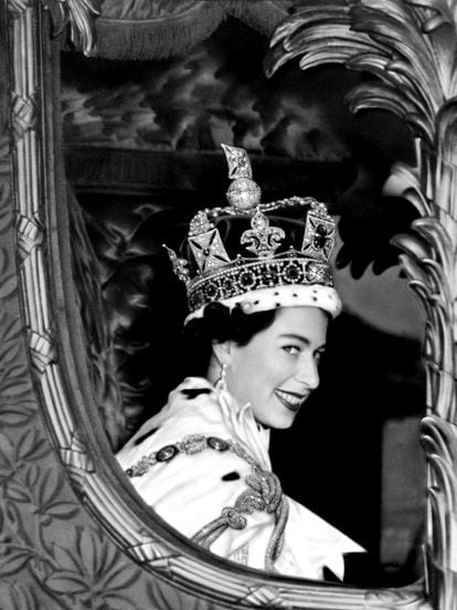Queen Elizabeth II gives a wide smile for the crowd from her carriage as she leaves Westminster Abbey, London after her coronation.  