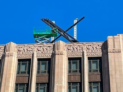 A large, metal "X" sign is seen on top of the downtown building that housed what was once Twitter, now rebranded by its owner, Elon Musk, in San Francisco, Friday, July 28, 2023.