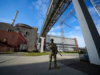 A Russian serviceman guards in an area of the Zaporizhzhia Nuclear Power Station in territory under Russian military control, southeastern Ukraine, May 1, 2022.