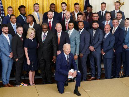 President Joe Biden kneels for a photo during an event celebrating the 2022 World Series champions the Houston Astros at the White House in Washington, on August 7, 2023.