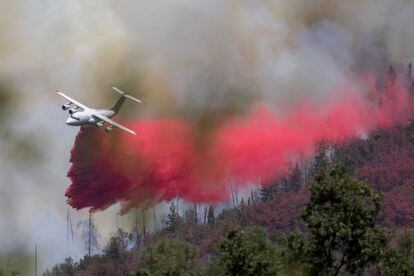 A fire retardant drop at the Oak Fire near Mariposa, California, on Sunday,