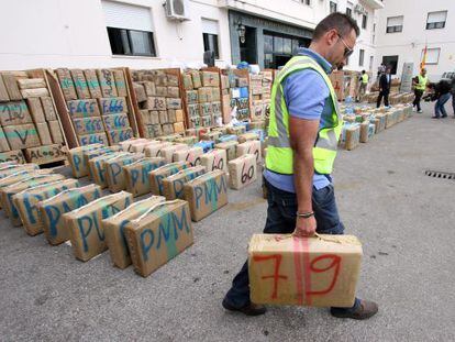 An officer from the Civil Guard moves a packet of hashish from the 32.3-ton haul of the drug that was intercepted in a truck at the port of Algeciras, C&aacute;diz province.