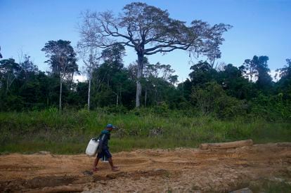 A miner walks to leave the Yanomami indigenous territory of Alto Alegre.