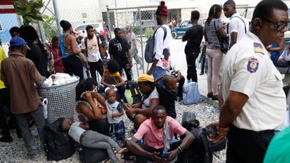 Haitians waiting to board a flight to Nicaragua