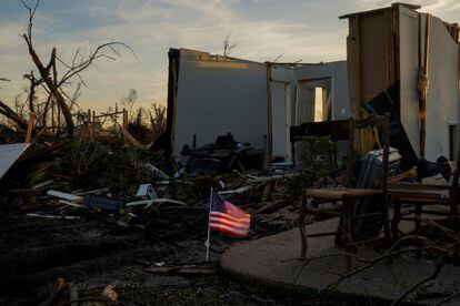 An American flag flies in front of the wreckage of a home after thunderstorms spawning high straight-line winds and tornadoes ripped across the state in Rolling Fork, Mississippi, U.S. March 27, 2023