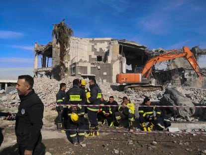 Emergency services clear the rubble of the house of Peshraw Dizayi that was hit in Iranian missile strikes in Irbil, Iraq, Tuesday, Jan. 16, 2024.
