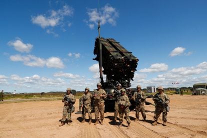 Soldiers pose in front of a Patriot anti-missile system during military exercises in Lithuania in 2017.