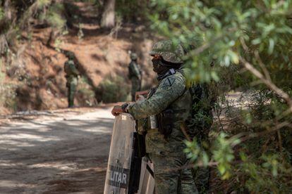 Special forces of the Mexican Army stand guard on a road in Aguililla.
