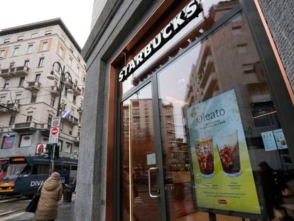 A Starbucks sign advertises the company's Oleato coffee in one of their coffee shops in Milan, Italy, Monday, Feb. 27, 2023. Putting olive oil in coffee is hardly a tradition in Italy, but that didn't stop Starbucks founder and CEO Howard Schultz from launching a series of beverages doing just that in Milan, the city that inspired his coffee house empire. (AP Photo/Antonio Calanni)