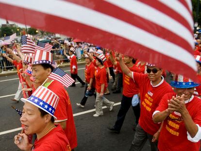 Tang De Wong, lower left, and other members of the Chinese Benevolent Association march in an Independence Day parade in Philadelphia, July 4, 2008.