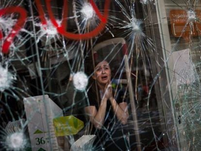 The award-winning photograph of a woman inside a Barcelona store during a protest to mark the March 2012 general strike.