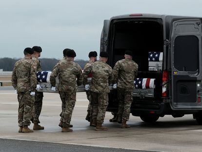 Members of the United States Honor Guard carry the remains of the three American service members who died in Jordan during a drone attack at Dover Air Base in Dover, Delaware.