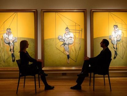 Visitors admire Francis Bacon’s ‘Three Studies of Lucian Freud’ at Christie’s in London.