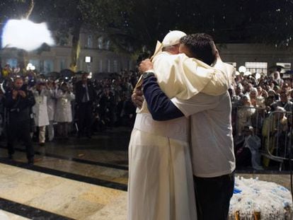 Pope Francis hugs a recovering drug addict during a visit to a hospital in Rio de Janeiro.