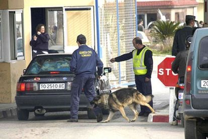 Civil Guard officers inspect an automobile at a border control point in Ceuta in 2007.