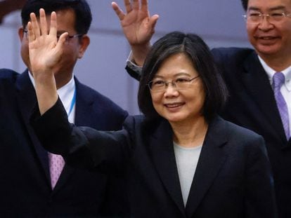 Taiwan's President Tsai Ing-wen waves near the boarding gate on the day of her departure to New York to start her trip, on March 29, 2023.