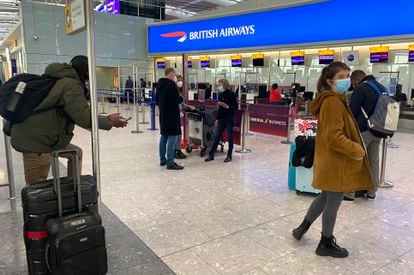 UK travelers returning to their homes in Spain wait to speak to airline staff after being refused boarding at London's Heathrow airport on January 2.