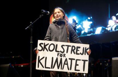 Swedish climate change activist Greta Thunberg holds her famous sign with the message “School strike for the climate.”