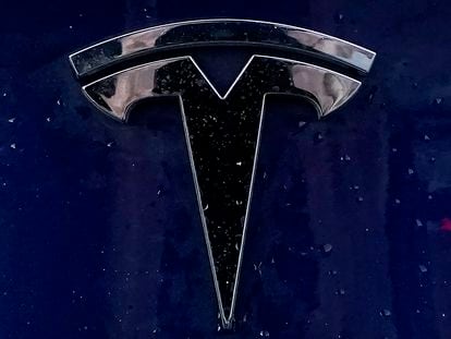 A Tesla electric vehicle emblem is affixed to a passenger vehicle Sunday, Feb. 21, 2021, in Boston.