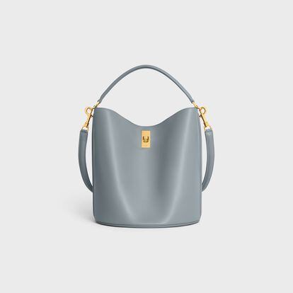 Elegant and functional at the same time, this Celine model in gray-blue can be worn over the shoulder, on the wrist or across the chest. €2,200/$2,950.

