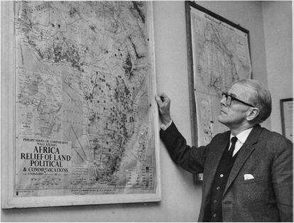 Surgeon Denis Burkitt studying a map of Africa in 1968.