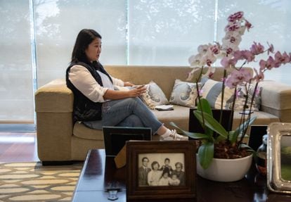 Keiko Fujimori in her apartment in Lima. In the foreground, a family portrait with her father, Peru’s last autocrat Alberto Fujimori.