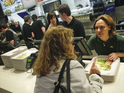 Patricia Abril, president of McDonald's España, listens to a customer in a Madrid franchise.