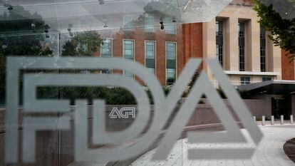 A U.S. Food and Drug Administration building is seen behind FDA logos at a bus stop on the agency's campus in Silver Spring, Md., on Aug. 2, 2018.