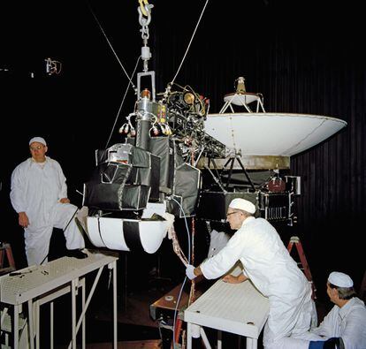 NASA technicians inspect one of the 'Voyagers' before its launch, in 1977.