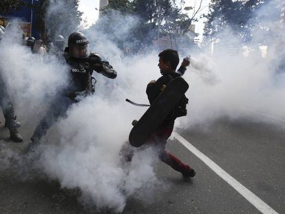Police and protestors clash on Sunday in Bogota.
