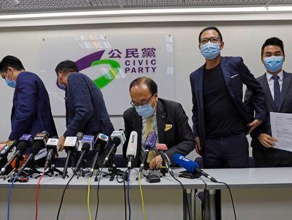 Pro-democracy Civic Party members leave a news conference after being disqualified for a legislative election in Hong Kong, on July 30, 2020.