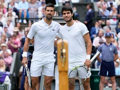 Serbia's Novak Djokovic, left, and Spain's Carlos Alcaraz pose for a photo ahead of the final of the men's singles on day fourteen of the Wimbledon tennis championships in London, Sunday, July 16, 2023.