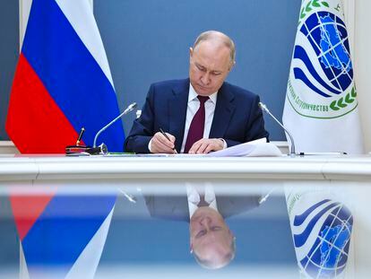 Russian President Vladimir Putin attends a signing ceremony during a meeting of the Shanghai Cooperation Organisation (SCO) Heads of State Council via videoconference at the Kremlin, in Moscow, Russia, Tuesday, July 4, 2023.