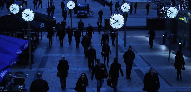 Workers in London's financial district make an early start.
