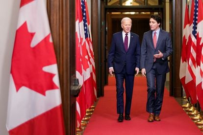 U.S. President Joe Biden walks with Canadian Prime Minister Justin Trudeau