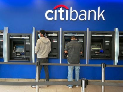 Customers use ATMs at a Citibank branch in the Jackson Heights neighborhood of the Queens borough of New York City, U.S. October 11, 2020.