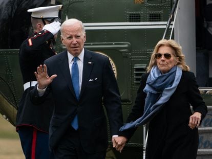 US President Joe Biden and First Lady Jill Biden walk on the South Lawn of the White House in Washington, DC, on January 23, 2022, as they return from a weekend in Rehoboth Beach, Delaware.