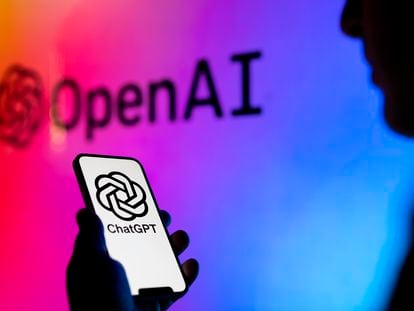 OpenAI and ChatGPT logos are seen on electronic device screens in this photo illustration in May 2023 in Warsaw, Poland.