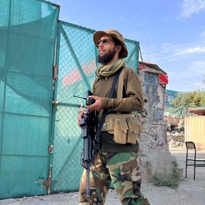 A Taliban militant at the site where the US says it killed Ayman al-Zawahri.