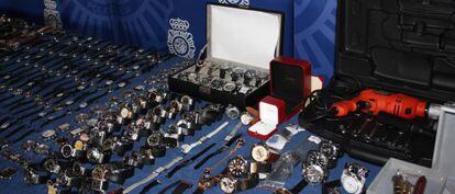 Watches siezed by the police and the tools used by the gang.