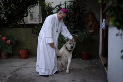 Salvador Rangel, bishop of Chilpancingo, with his dog inside the episcopal residence. 