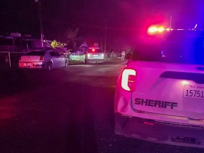 In this image released by Tulare County Sheriff's Office, detectives investigate a shooting in Goshen near Visalia, Calif., early morning Monday, Jan. 16, 2023.