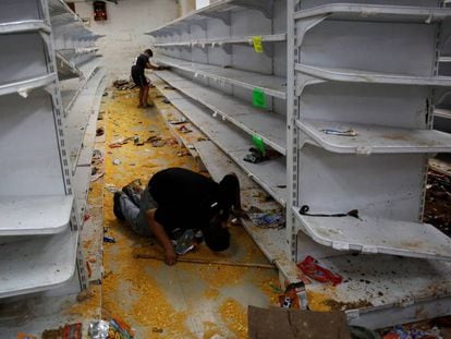 A looted supermarket in Caracas on Friday.
