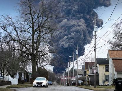 A black plume rises over East Palestine, Ohio, as a result of a controlled detonation of a portion of the derailed Norfolk Southern trains, on Feb. 6, 2023.