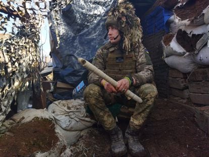 A soldier in the trenches in Adviidka, in Ukraine's Donbas region. 